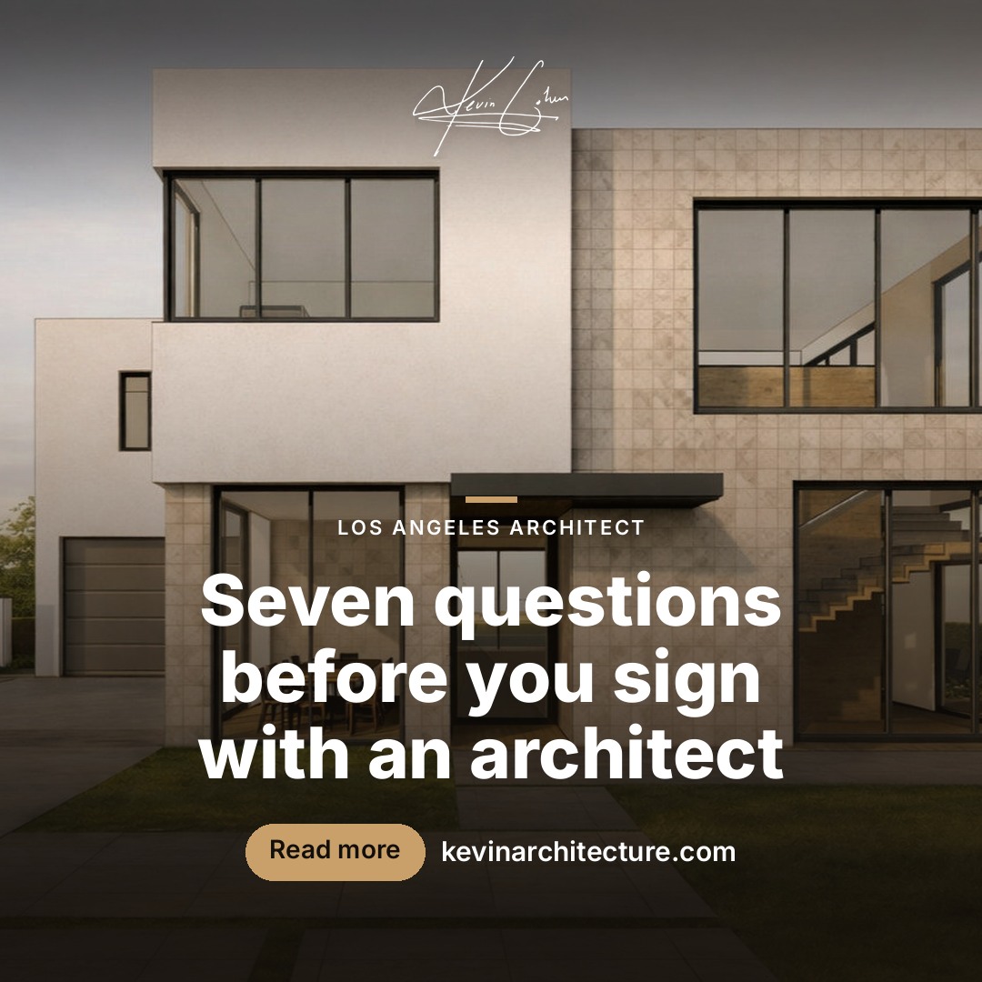 Contemporary two-storey home with stone cladding and large glazing at dusk